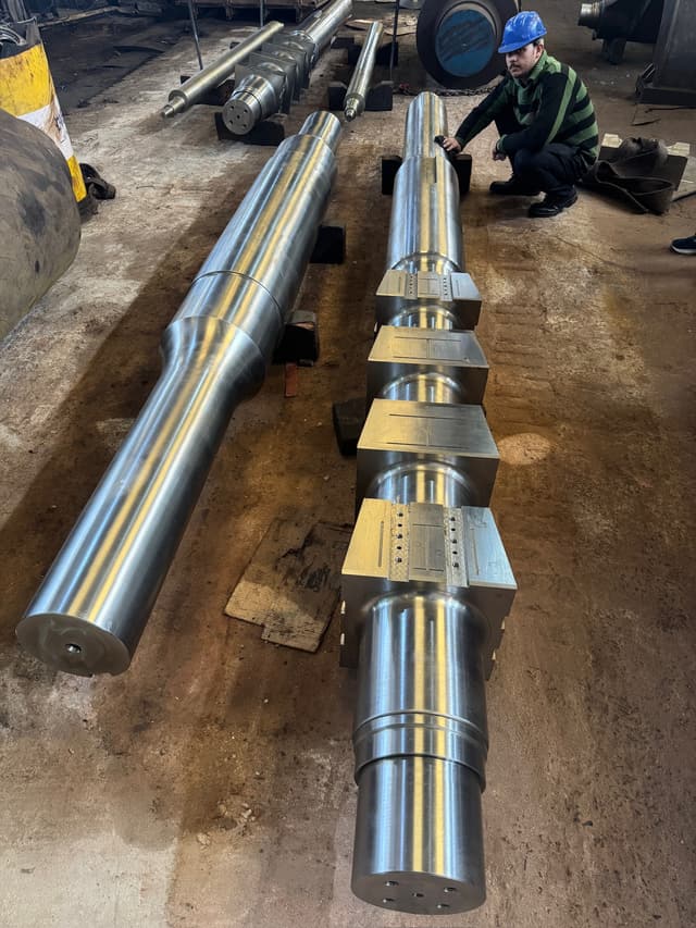 Long shafts and a stepped pyramid shaft laid out along the machine bay.
